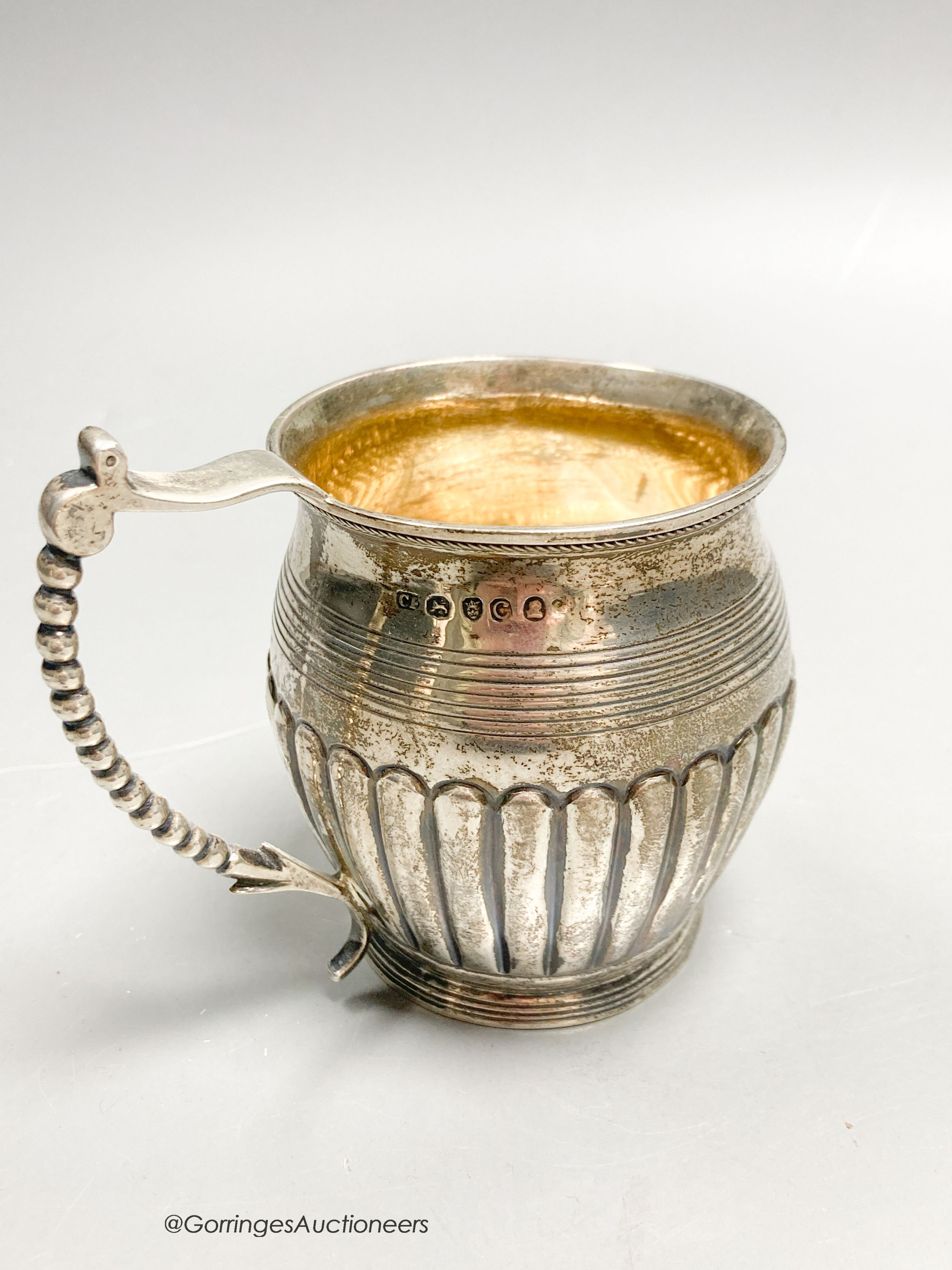 A late George III demi fluted silver christening mug, Crispin Fuller?, London 1818, 85mm, 3.5oz.